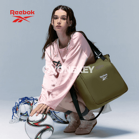 Gyzlar üçin owadan we giň köpugurly Reebok sumka