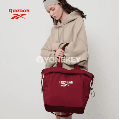Gyzlar üçin niýetlenen giň we owadan Reebok sumka
