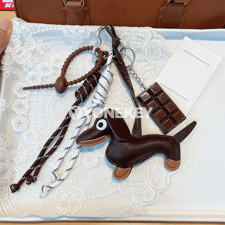 Dachshund görnüşli açarlukly sumka asylgysy, döredijilikli aksesuar