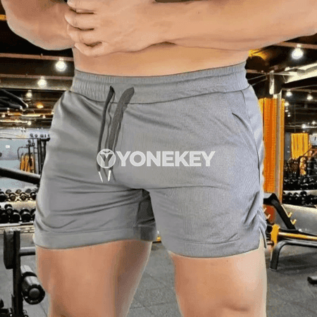 Erkekler üçin ýazlyk ýeňil sport şortikleri, dem alýan mesh gurluşly